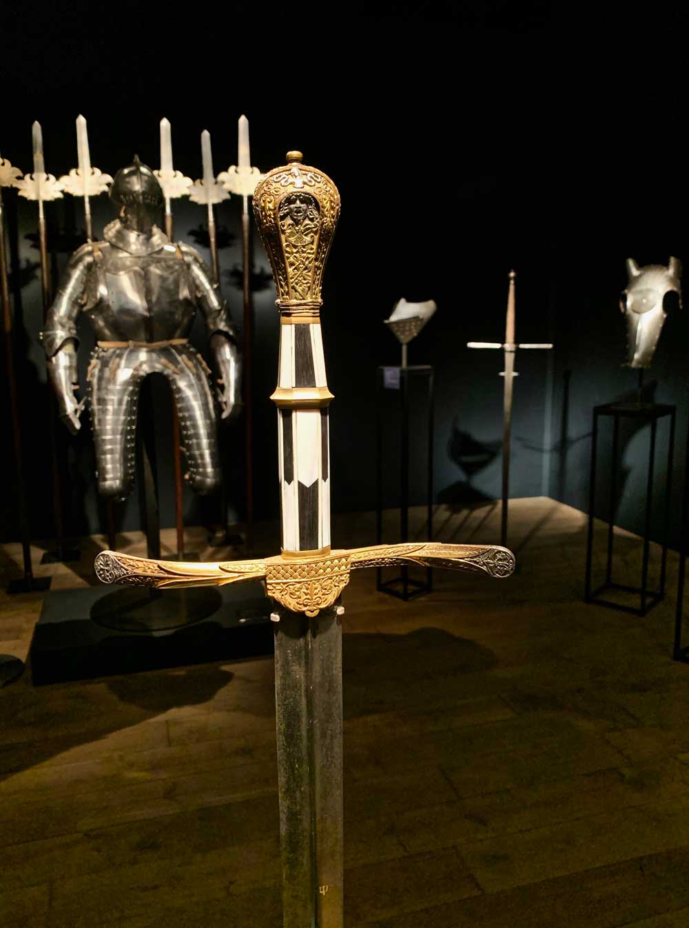 The grip and efinely decorated pommel of this Italian style renaissance sword, In the background you get a glimpse of the Ducal field armour. photo: Albert Ehrnrooth